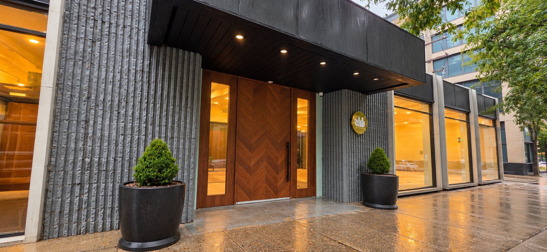 The walnut front door on LaSalle Drive